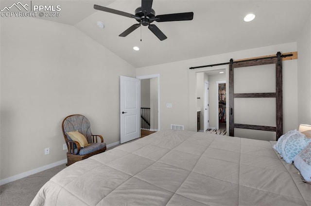 carpeted bedroom with baseboards, visible vents, lofted ceiling, recessed lighting, and a barn door