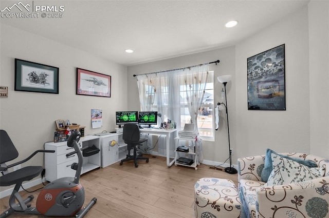 home office with recessed lighting, baseboards, and light wood finished floors