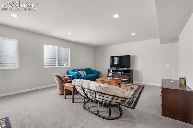 living area featuring recessed lighting, baseboards, and carpet floors