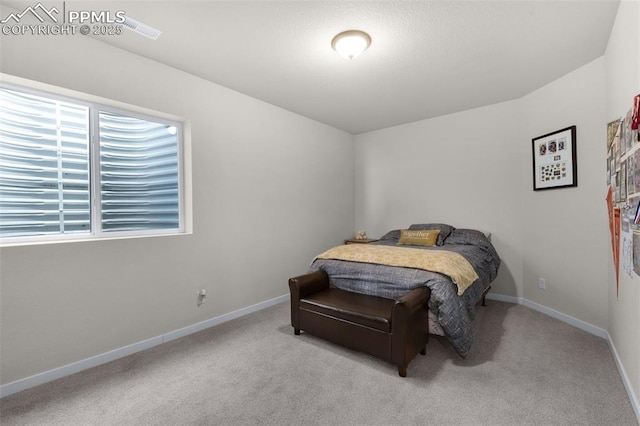 bedroom with carpet flooring and baseboards