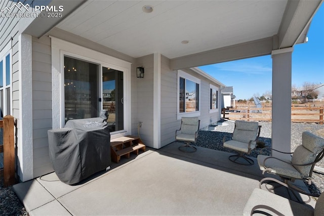 view of patio with fence