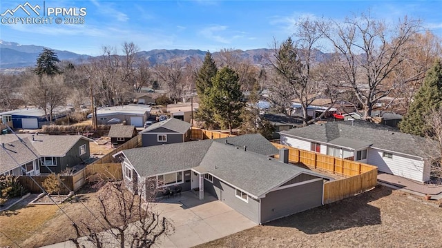 drone / aerial view featuring a residential view and a mountain view