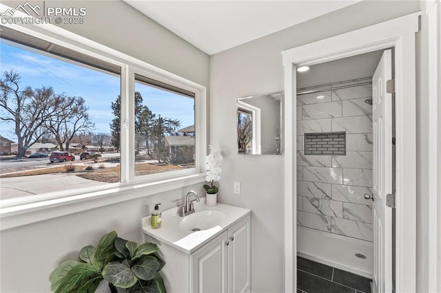 full bathroom featuring a stall shower and vanity