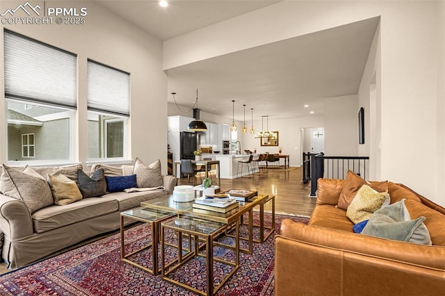 living area with wood finished floors and recessed lighting