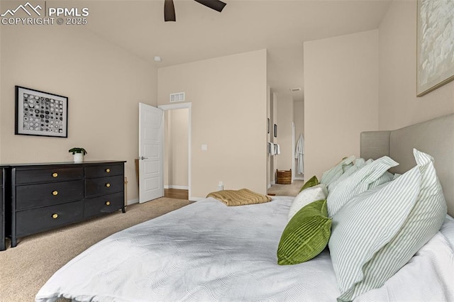 carpeted bedroom featuring baseboards, visible vents, and a ceiling fan