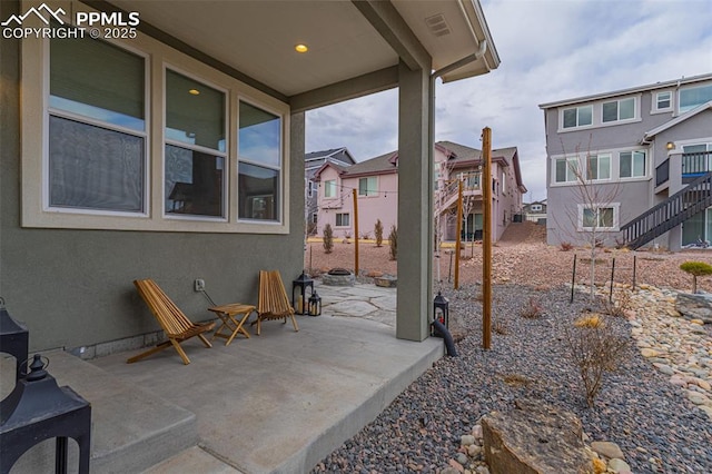 view of patio with a residential view