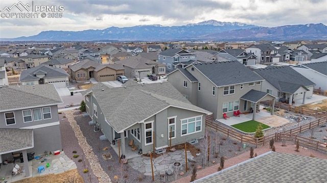 bird's eye view with a residential view and a mountain view