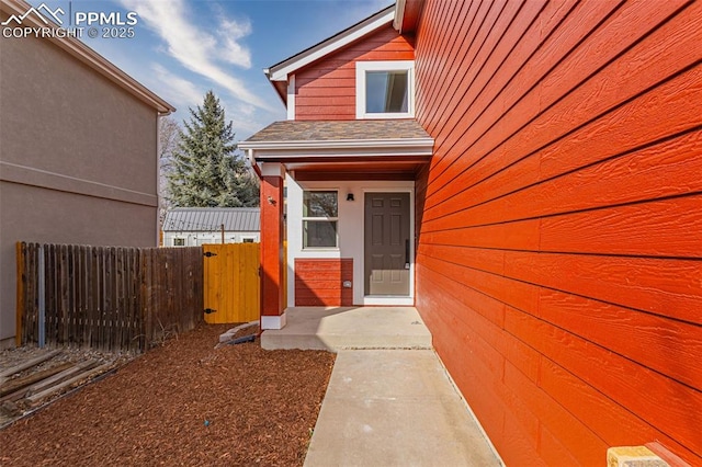 doorway to property with fence