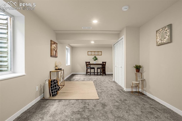 carpeted dining area featuring recessed lighting, visible vents, and baseboards