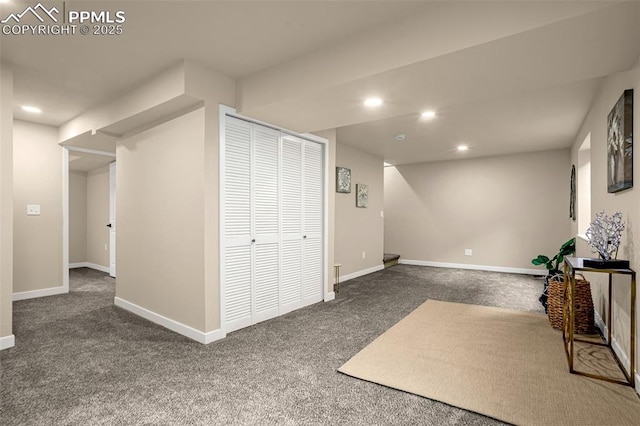 interior space with recessed lighting, baseboards, and dark colored carpet