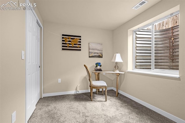 carpeted office with baseboards and visible vents