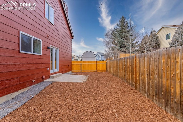 view of yard with a patio and a fenced backyard