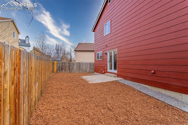 view of yard featuring a fenced backyard and a patio