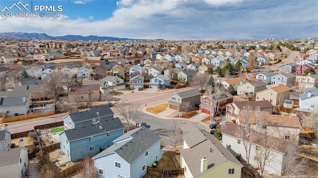 bird's eye view with a residential view and a mountain view