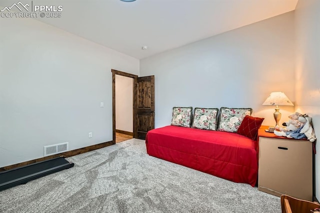 carpeted bedroom with visible vents and baseboards