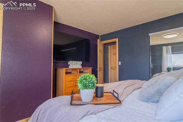 bedroom featuring a textured ceiling