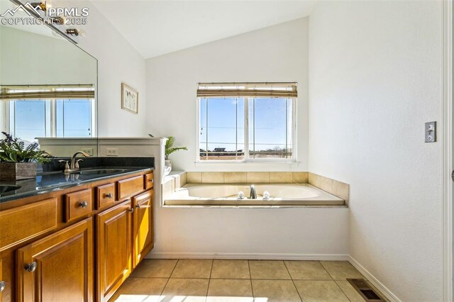 7619 High Gate Dr, Fountain, CO 80817 - full bath featuring visible vents, lofted ceiling, tile patterned flooring, vanity, and a bath