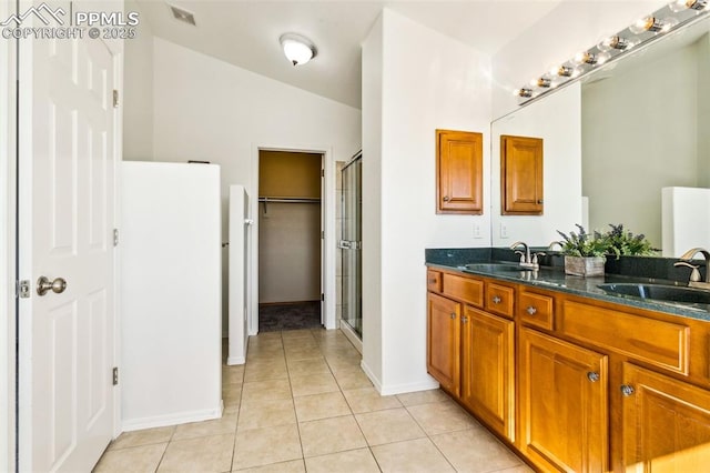 7619 High Gate Dr, Fountain, CO 80817 - bathroom with a stall shower, tile patterned flooring, visible vents, and a sink