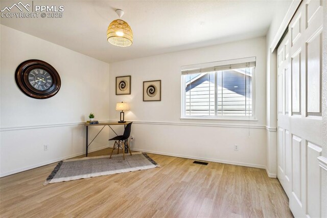 7619 High Gate Dr, Fountain, CO 80817 - office area featuring visible vents, baseboards, and wood finished floors