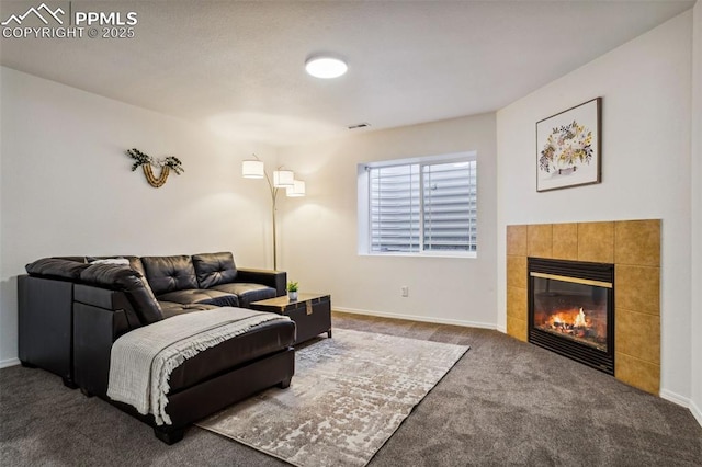 7619 High Gate Dr, Fountain, CO 80817 - living room featuring baseboards, visible vents, carpet flooring, and a tile fireplace