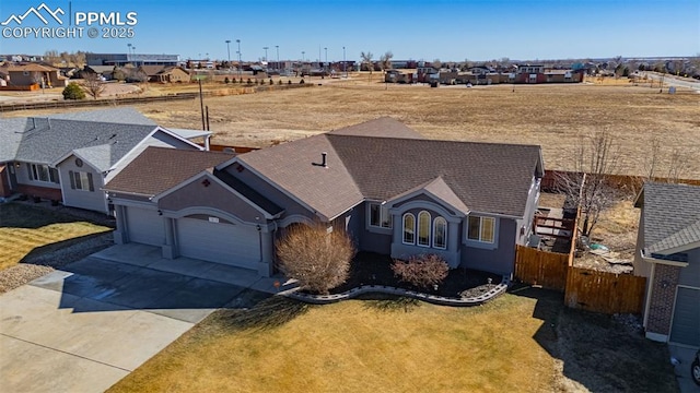 7619 High Gate Dr, Fountain, CO 80817 - view of front of home with a residential view, fence, concrete driveway, and a front yard