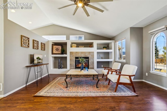 7619 High Gate Dr, Fountain, CO 80817 - sitting room featuring lofted ceiling, dark wood-style flooring, a wealth of natural light, and built in features