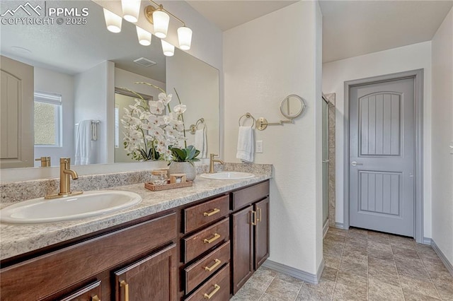 bathroom featuring a stall shower, visible vents, a sink, and double vanity