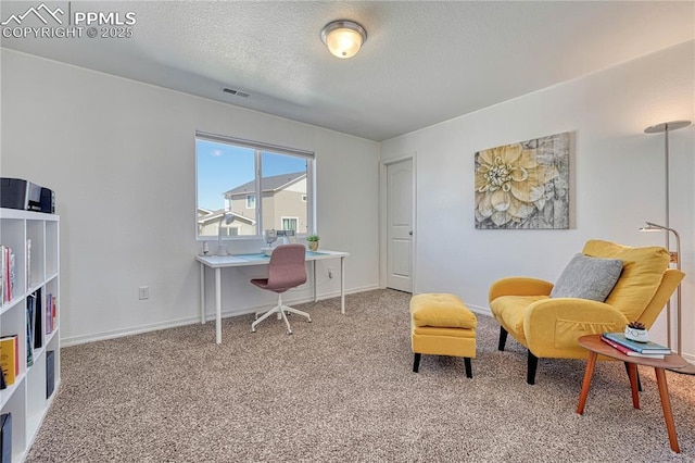 office area with baseboards, carpet, visible vents, and a textured ceiling