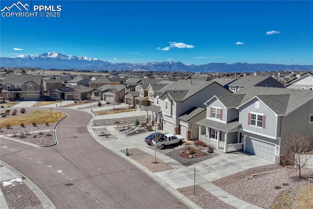 bird's eye view with a residential view and a mountain view