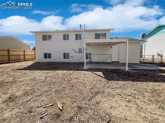 back of property featuring a patio area and a fenced backyard