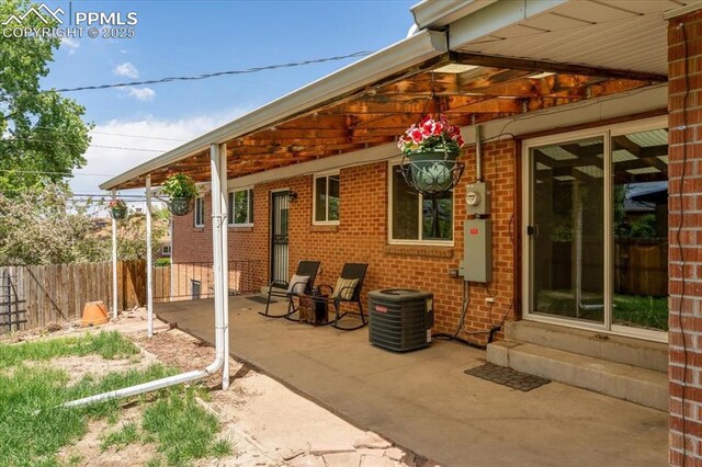 1328 Swope Ave, Colorado Springs, CO 80909 - view of patio featuring entry steps and central AC