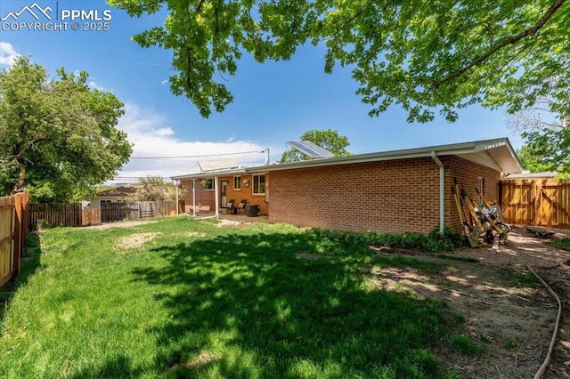 1328 Swope Ave, Colorado Springs, CO 80909 - view of yard featuring a patio
