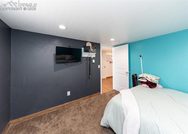 bedroom featuring recessed lighting, carpet, and baseboards