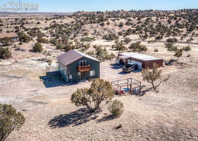 drone / aerial view featuring view of desert