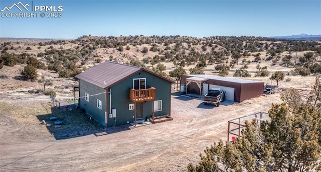 birds eye view of property with a desert view