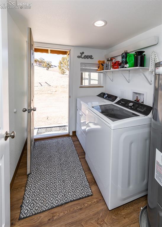 laundry room with recessed lighting, laundry area, baseboards, washer and dryer, and dark wood-style floors