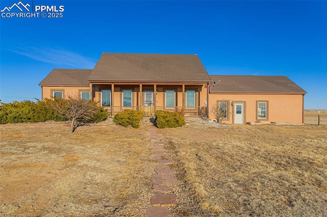 view of front facade featuring a porch and stucco siding