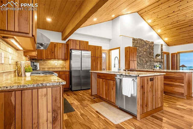 kitchen with brown cabinetry, wooden ceiling, wall chimney exhaust hood, stainless steel appliances, and a sink