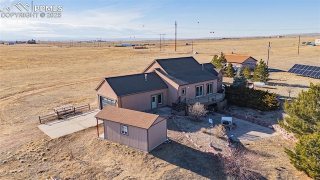 birds eye view of property featuring a rural view