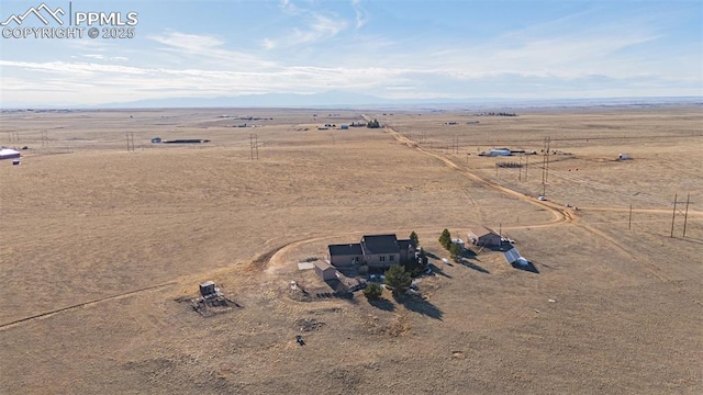 bird's eye view with a rural view and a desert view