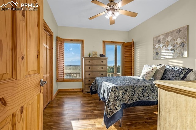 bedroom featuring ceiling fan, wood finished floors, and baseboards