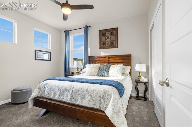 carpeted bedroom featuring a ceiling fan and baseboards