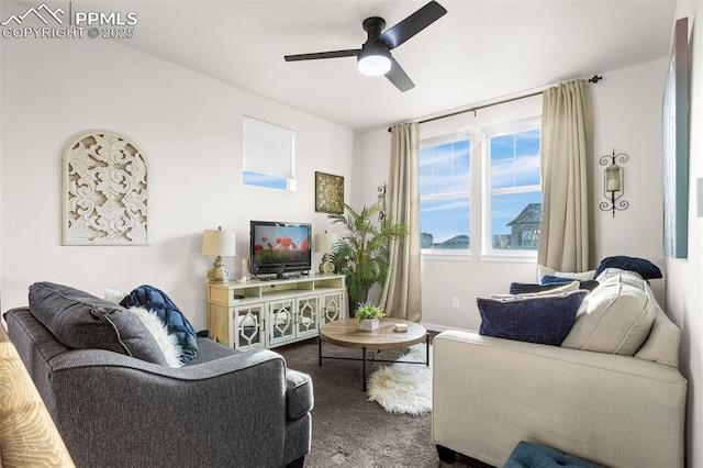 carpeted living area with ceiling fan