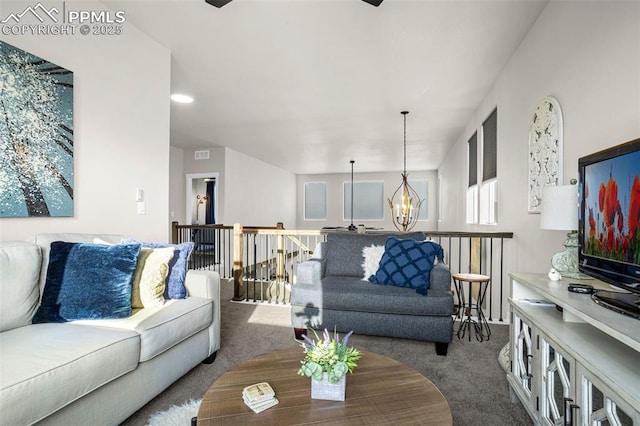 living area with carpet flooring and a notable chandelier