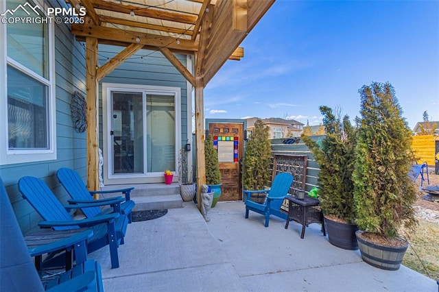 view of patio / terrace featuring fence