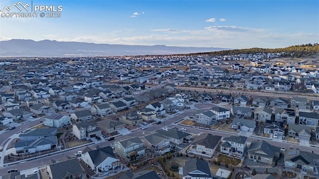 birds eye view of property with a residential view and a mountain view