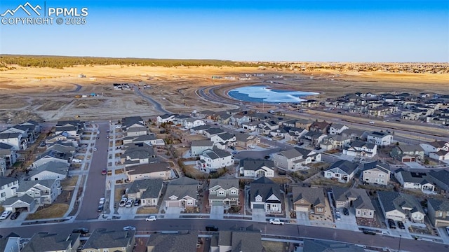 birds eye view of property with a residential view