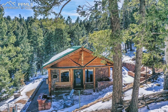 chalet / cabin with a forest view