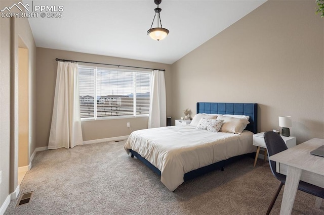 carpeted bedroom with visible vents, vaulted ceiling, and baseboards