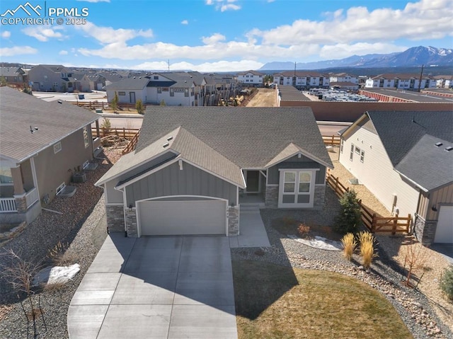 drone / aerial view featuring a mountain view and a residential view